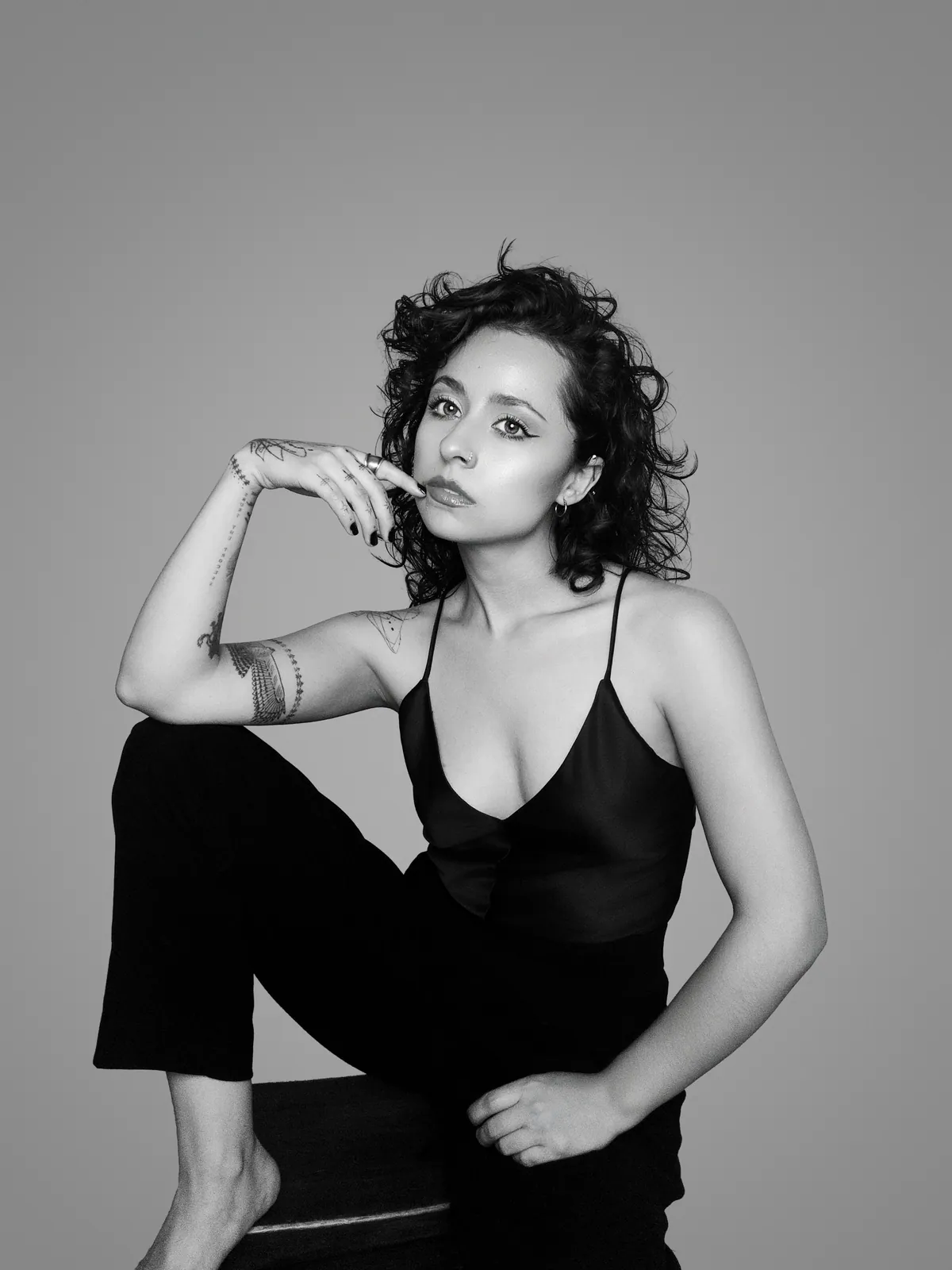 Paula Andrea Acevedo seated, her chin resting on her hand