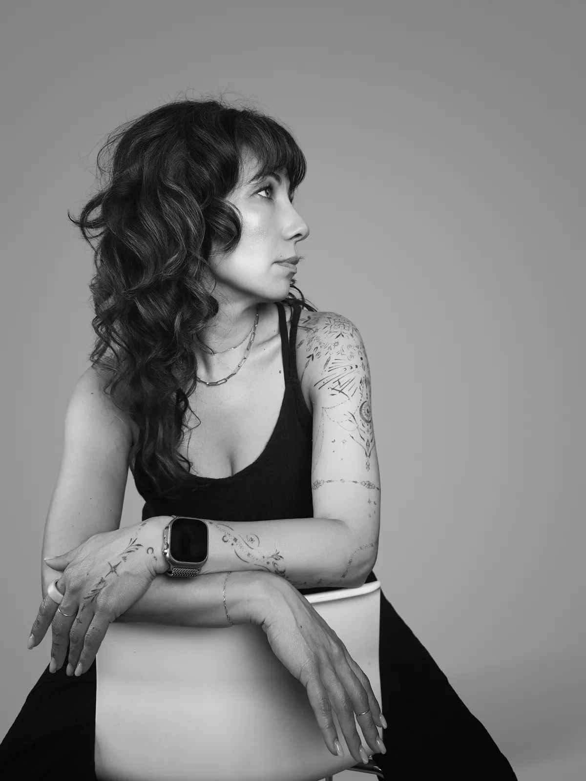 Studio portrait of a woman wearing her tattoos, photograph 4 of 16