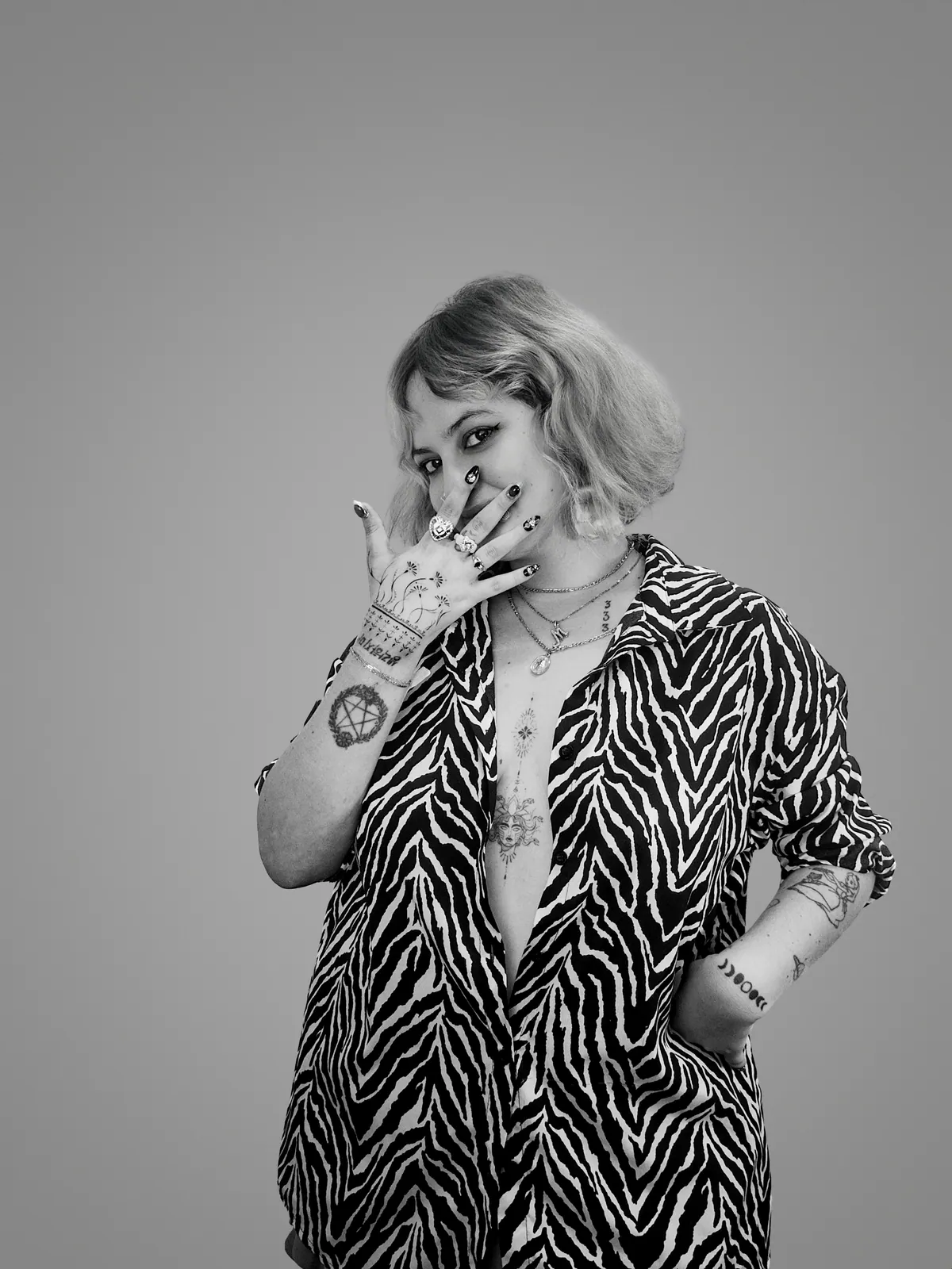 Studio portrait of a woman wearing her tattoos, photograph 8 of 16