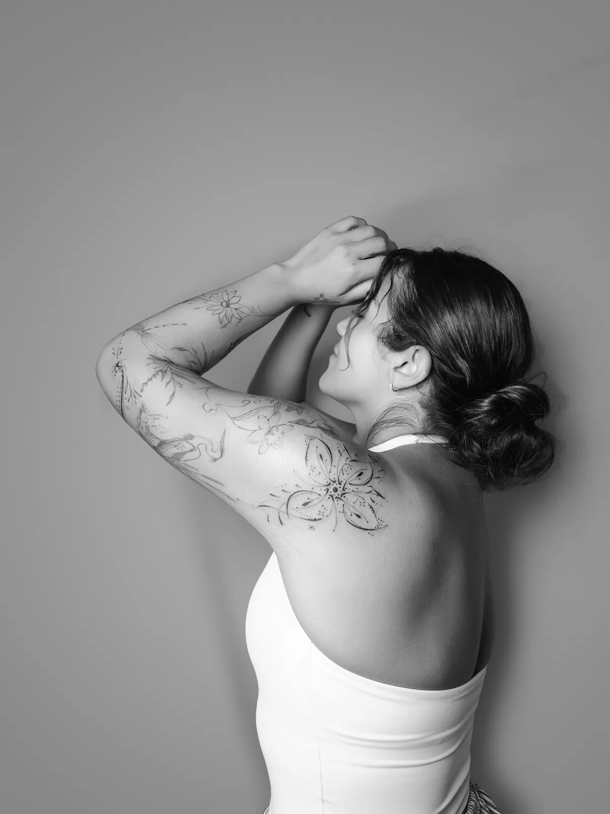 Studio portrait of a woman wearing her tattoos, photograph 14 of 16